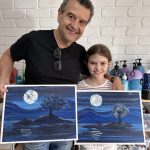 Parents and children expressing creativity in an art class