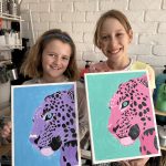 A cozy art studio filled with children painting